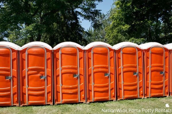 a lineup of clean and well-maintained portable loos for workers in Quaker Hill, CT
